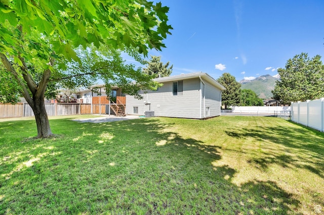 8026 S Erique Way, Cottonwood Heights, UT 84093 - view of yard featuring a mountain view, a patio area, and central air condition unit