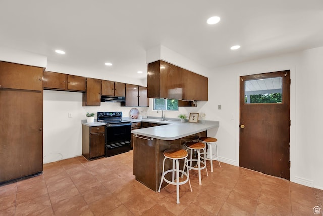 8026 S Erique Way, Cottonwood Heights, UT 84093 - kitchen with black range with electric stovetop, extractor fan, a peninsula, a sink, and a breakfast bar area
