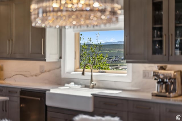 6380 N Silver Sage Dr, Park City, UT 84098 - bar featuring dishwashing machine, a mountain view, tasteful backsplash, and a sink