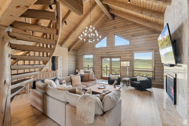 6380 N Silver Sage Dr, Park City, UT 84098 - living room with wooden ceiling with exposed beams, high vaulted ceiling, a high end fireplace, hardwood / wood-style flooring, and a chandelier