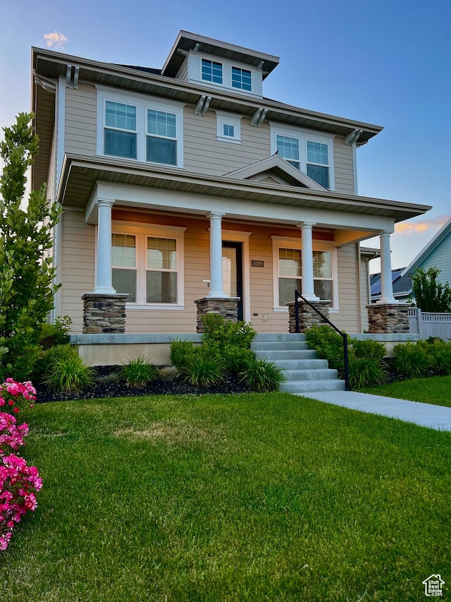 5028 W Lake Terrace Ave, South Jordan, UT 84009 - traditional style home featuring a front lawn and covered porch