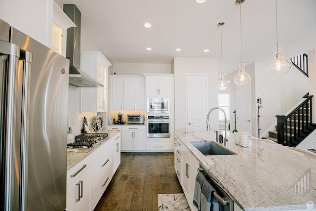 5028 W Lake Terrace Ave, South Jordan, UT 84009 - kitchen with appliances with stainless steel finishes, a sink, wall chimney exhaust hood, a spacious island, and dark wood-type flooring