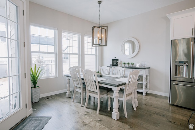 5028 W Lake Terrace Ave, South Jordan, UT 84009 - dining room featuring a chandelier, dark wood finished floors, and baseboards