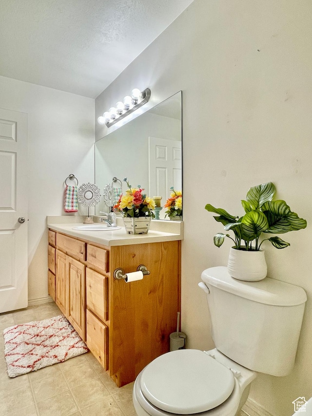652 W 800 N Unit 112, Clinton, UT 84015 - half bath featuring vanity, tile patterned flooring, and toilet