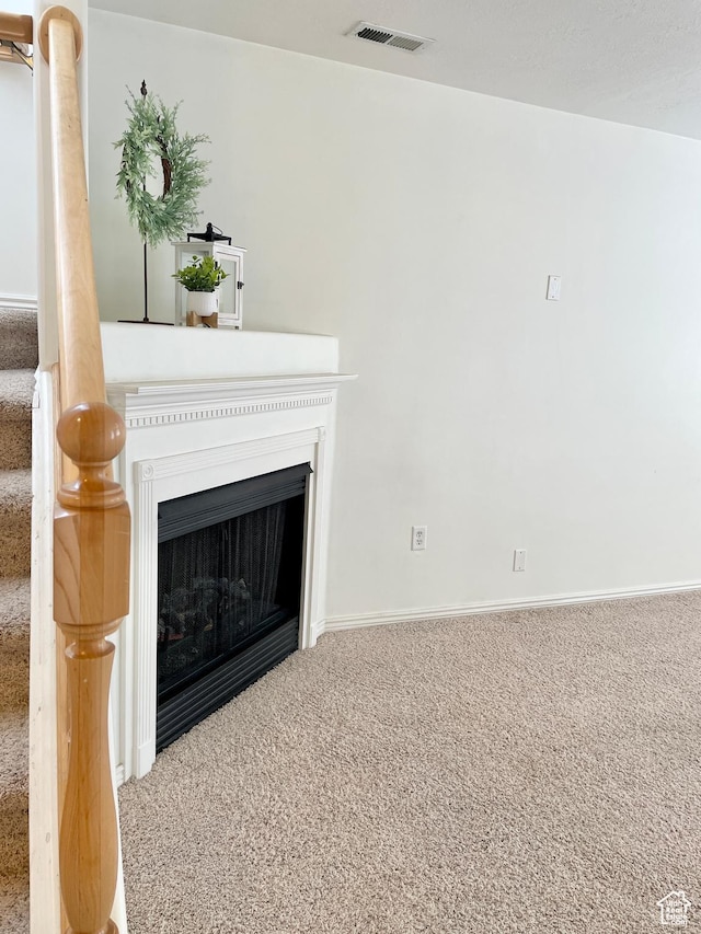 652 W 800 N Unit 112, Clinton, UT 84015 - unfurnished living room featuring carpet, baseboards, and a fireplace