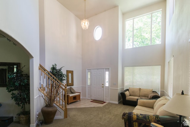 274 E Park Knoll Cir, Sandy, UT 84070 - entryway featuring a towering ceiling, carpet, stairs, arched walkways, and a chandelier