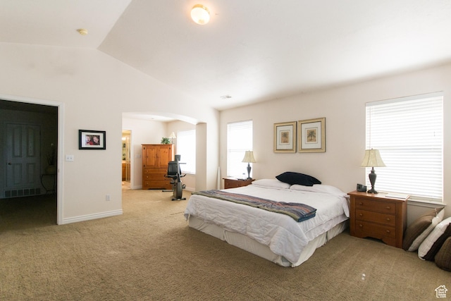 274 E Park Knoll Cir, Sandy, UT 84070 - bedroom with light colored carpet, lofted ceiling, arched walkways, connected bathroom, and baseboards
