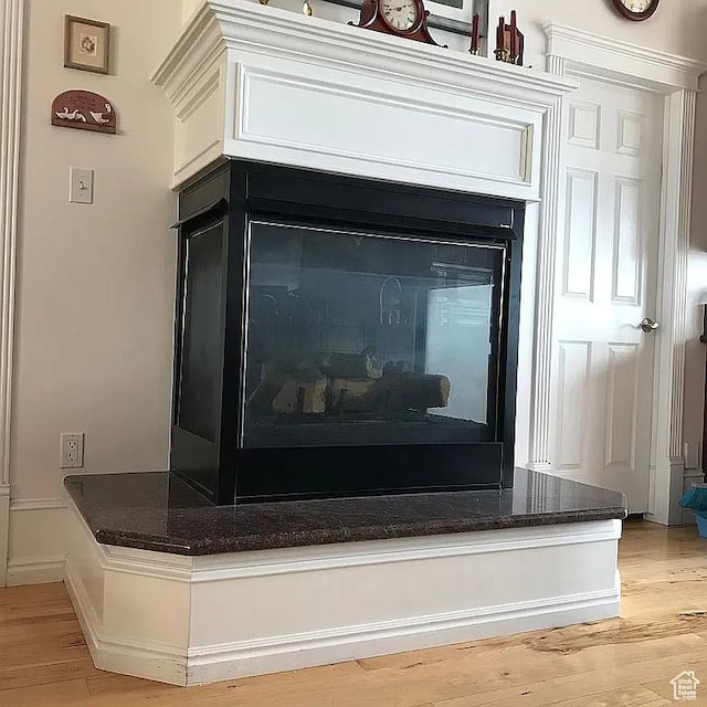 4093 Imperial Way, Provo, UT 84604 - detailed view of wood finished floors and a fireplace with raised hearth