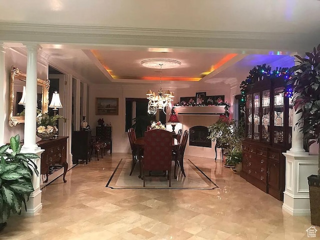 4093 Imperial Way, Provo, UT 84604 - dining space with a chandelier, a tray ceiling, ornate columns, and ornamental molding