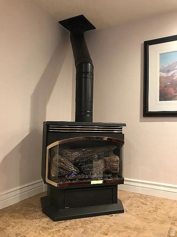 4093 Imperial Way, Provo, UT 84604 - detailed view of baseboards and a wood stove