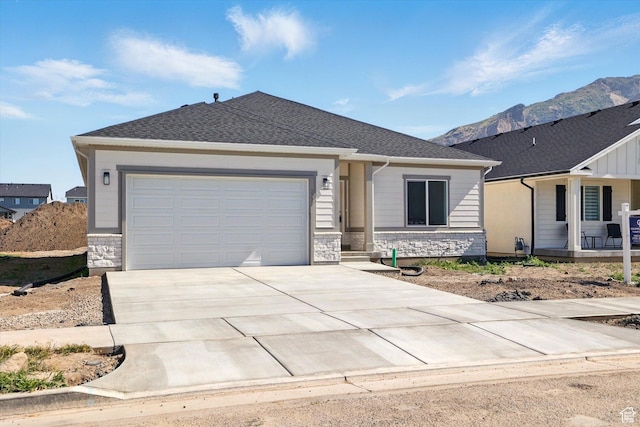 222 W 825 S, Willard, UT 84340 - single story home featuring driveway, an attached garage, a mountain view, stone siding, and a porch