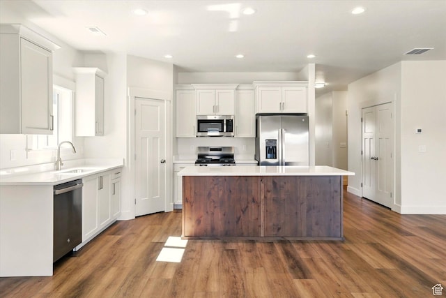 222 W 825 S, Willard, UT 84340 - kitchen featuring stainless steel appliances, a center island, dark wood-style flooring, white cabinetry, and recessed lighting