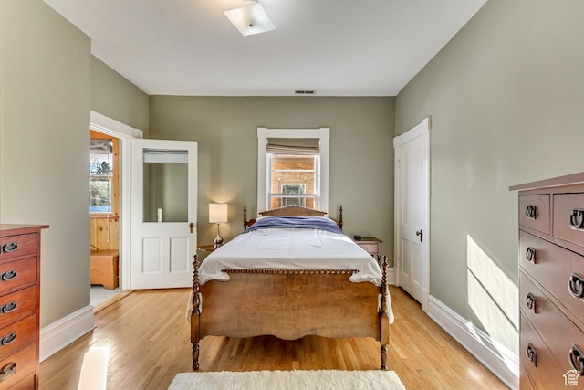 15 S 1200 E, Salt Lake City, UT 84102 - bedroom with light wood-style floors, baseboards, and a skylight