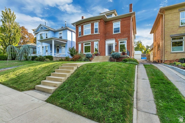 15 S 1200 E, Salt Lake City, UT 84102 - view of front of home with brick siding, a front yard, a chimney, a porch, and an outdoor structure