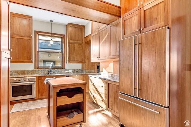 15 S 1200 E, Salt Lake City, UT 84102 - kitchen featuring stainless steel oven, paneled refrigerator, wood counters, a sink, and open shelves