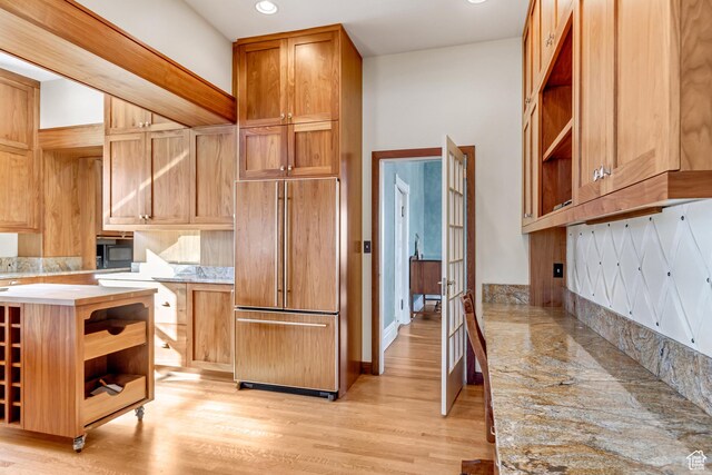 15 S 1200 E, Salt Lake City, UT 84102 - kitchen featuring paneled fridge, open shelves, light countertops, light wood finished floors, and recessed lighting