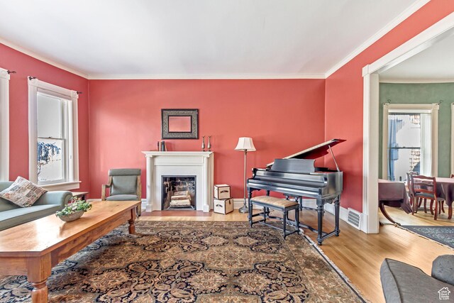 15 S 1200 E, Salt Lake City, UT 84102 - living area with wood finished floors, crown molding, a fireplace with flush hearth, and baseboards