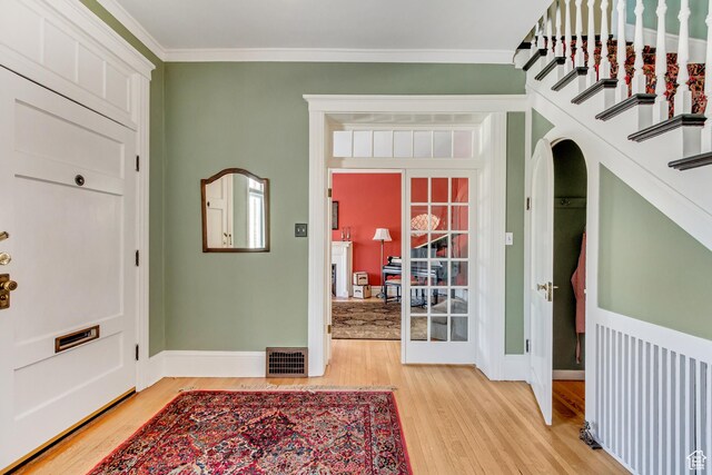 15 S 1200 E, Salt Lake City, UT 84102 - foyer entrance with light wood-style flooring, baseboards, and ornamental molding