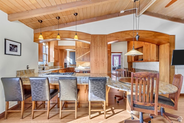 15 S 1200 E, Salt Lake City, UT 84102 - kitchen with wood ceiling, a peninsula, light wood-type flooring, stainless steel gas stovetop, and light stone counters