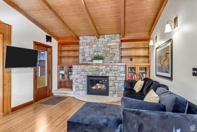 15 S 1200 E, Salt Lake City, UT 84102 - living room with wood ceiling, wood finished floors, built in shelves, a fireplace, and baseboards