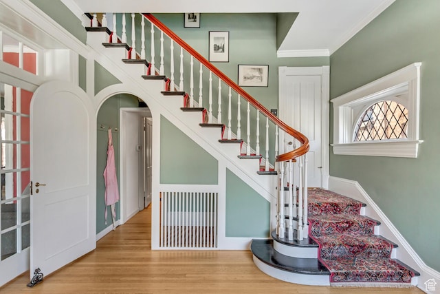 15 S 1200 E, Salt Lake City, UT 84102 - staircase featuring crown molding, arched walkways, and wood finished floors