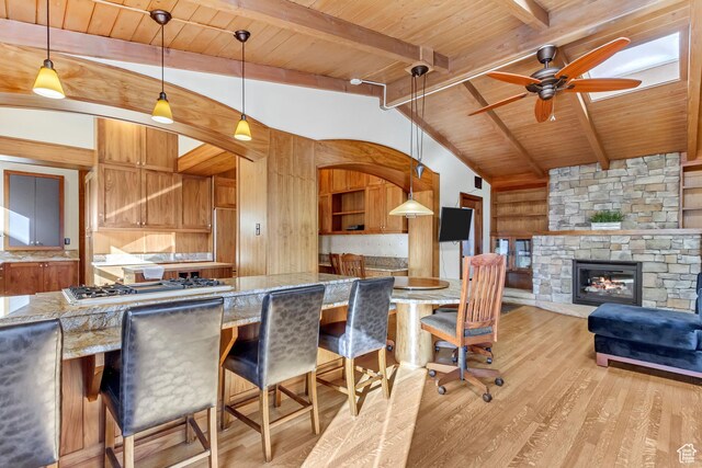 15 S 1200 E, Salt Lake City, UT 84102 - kitchen with wooden ceiling, stainless steel gas stovetop, light wood-style floors, a ceiling fan, and a fireplace