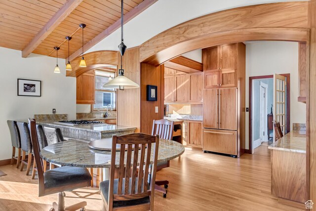 15 S 1200 E, Salt Lake City, UT 84102 - dining area with arched walkways, light wood finished floors, baseboards, and wood ceiling
