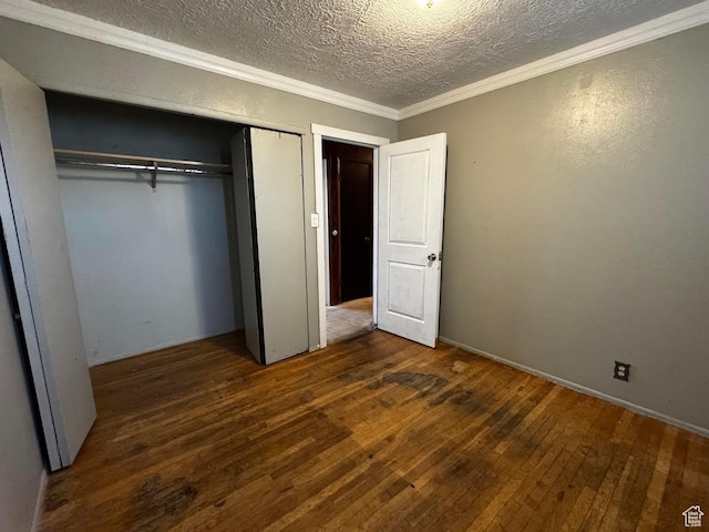 635 N Chimesview Cir E, Tooele, UT 84074 - unfurnished bedroom featuring a textured ceiling, wood-type flooring, ornamental molding, and a closet