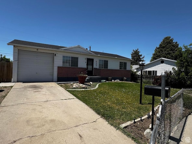 635 N Chimesview Cir E, Tooele, UT 84074 - single story home with a garage, driveway, and brick siding