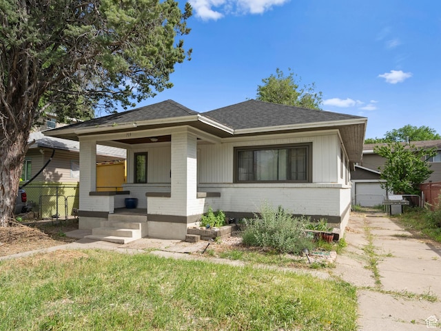 719 E 22nd St, Ogden, UT 84401 - bungalow-style house featuring brick siding, covered porch, and a shingled roof