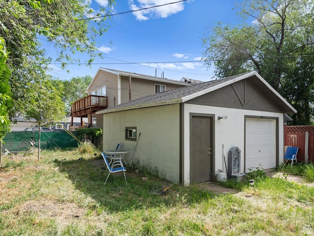 719 E 22nd St, Ogden, UT 84401 - view of property exterior with a shingled roof, an outbuilding, a garage, and stucco siding