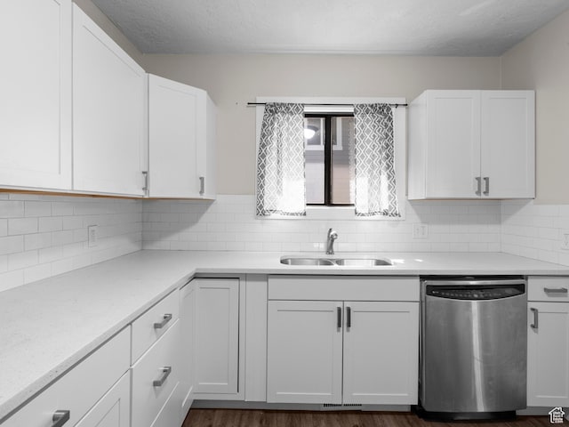 719 E 22nd St, Ogden, UT 84401 - kitchen with dishwasher, a sink, white cabinetry, light countertops, and tasteful backsplash