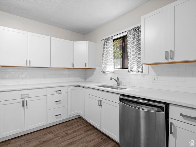 719 E 22nd St, Ogden, UT 84401 - kitchen featuring dishwasher, a sink, light countertops, white cabinets, and a textured ceiling