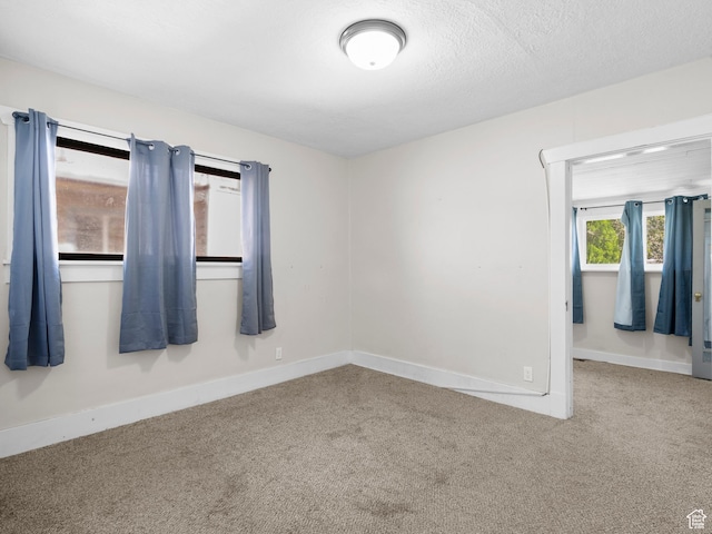 719 E 22nd St, Ogden, UT 84401 - carpeted empty room with baseboards