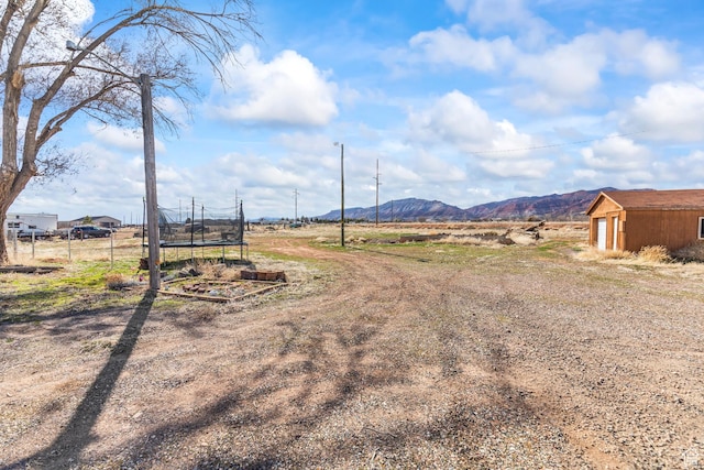 1725 N State St, Sigurd, UT 84657 - view of yard with a trampoline, a mountain view, and a storage unit