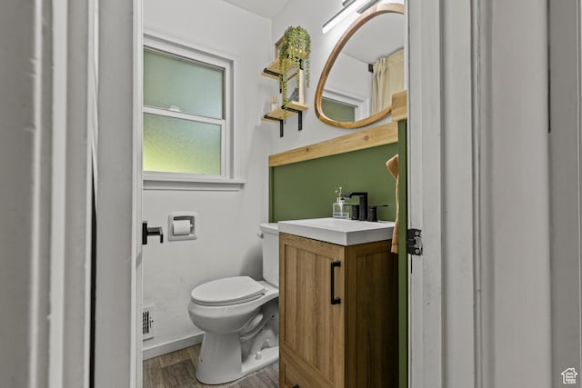 3510 Porter Ave, Ogden, UT 84403 - bathroom with toilet, vanity, and wood finished floors