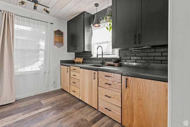 3510 Porter Ave, Ogden, UT 84403 - kitchen featuring a sink, dark countertops, decorative backsplash, and dark wood-style floors