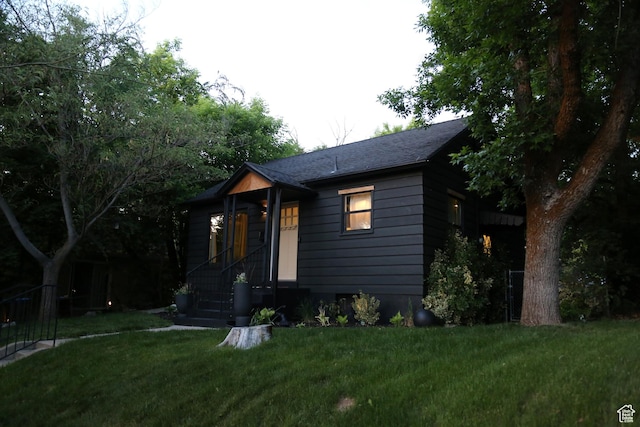 3510 Porter Ave, Ogden, UT 84403 - view of front of property with a front lawn and roof with shingles