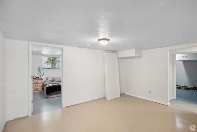 2137 W 6200 S, Salt Lake City, UT 84129 - below grade area featuring baseboards and a textured ceiling