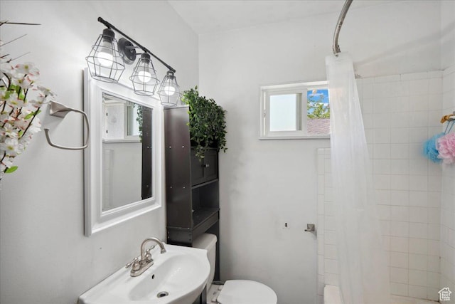 2137 W 6200 S, Salt Lake City, UT 84129 - full bathroom featuring a sink, toilet, and a shower with shower curtain