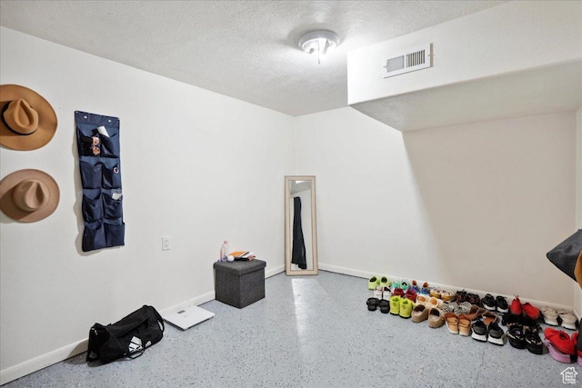 2137 W 6200 S, Salt Lake City, UT 84129 - playroom featuring baseboards, a textured ceiling, and speckled floor