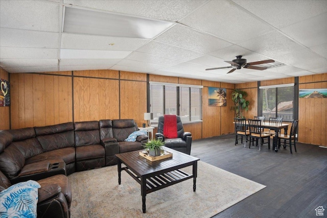 2137 W 6200 S, Salt Lake City, UT 84129 - living area featuring a paneled ceiling, wooden walls, a ceiling fan, and wood finished floors