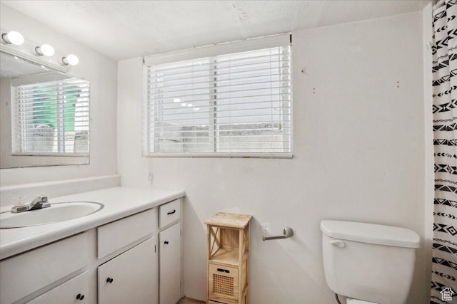 2137 W 6200 S, Salt Lake City, UT 84129 - bathroom with vanity, toilet, a textured ceiling, and a shower with shower curtain