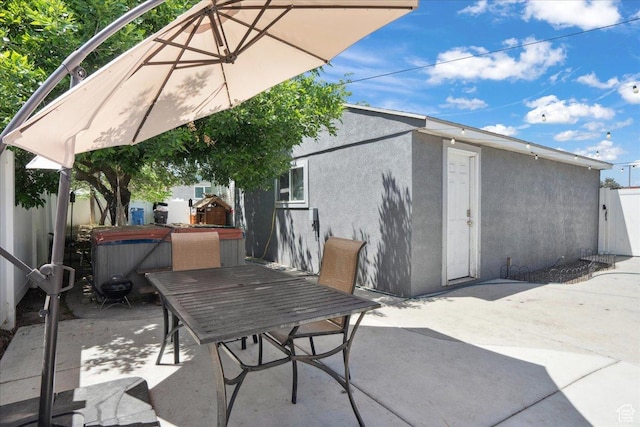 2137 W 6200 S, Salt Lake City, UT 84129 - view of patio with outdoor dining space and a hot tub