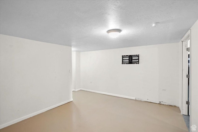 2137 W 6200 S, Salt Lake City, UT 84129 - spare room featuring a textured ceiling, concrete floors, and baseboards