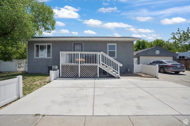 2137 W 6200 S, Salt Lake City, UT 84129 - view of front of property featuring stucco siding, an outdoor structure, and central air condition unit