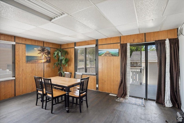 2137 W 6200 S, Salt Lake City, UT 84129 - dining area featuring wooden walls, a drop ceiling, and dark wood-style floors