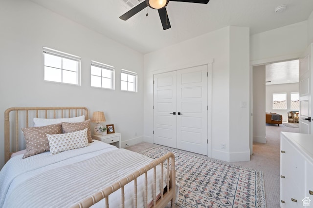 3322 S 2240 E, St George, UT 84790 - bedroom with light carpet, multiple windows, a closet, and baseboards