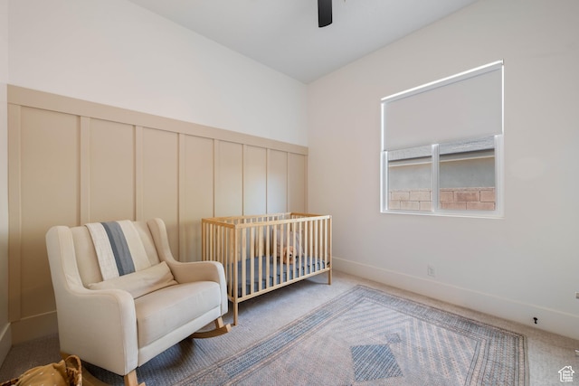 3322 S 2240 E, St George, UT 84790 - carpeted bedroom with a decorative wall, ceiling fan, and a crib