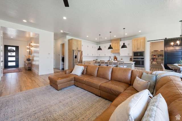 3322 S 2240 E, St George, UT 84790 - living room with a chandelier, baseboards, recessed lighting, and light wood-style flooring